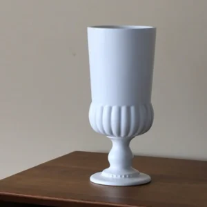 White Ribbed Ceramic Urn Vase with Pedestal Foot in ivory — front view