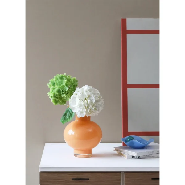 French Mid-Century Ruffled Gourd Glass Vase in rust — in a room setting