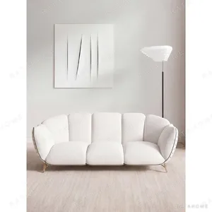 Aria French Riveted Sofa in oatmeal — in a room setting