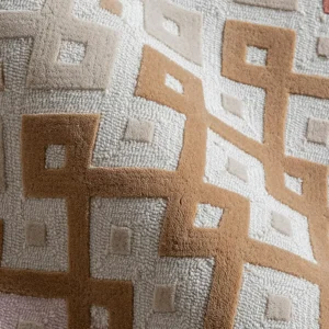 Fretwork Lattice Rug in Blush, Coral and Sand — in a room setting