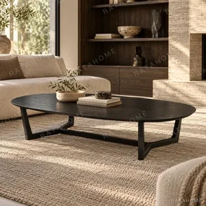 Black Veneer Oval Coffee Table on Splayed Base, 156 x 58 cm in black — in a room setting