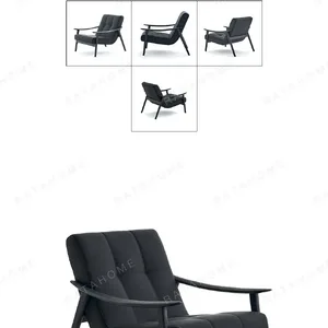 Fynn Black Ash Lounge Chair in Black Leather — in a room setting