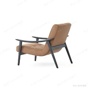 Fynn Black Ash Lounge Chair in Caramel Microfibre Leather — in a room setting