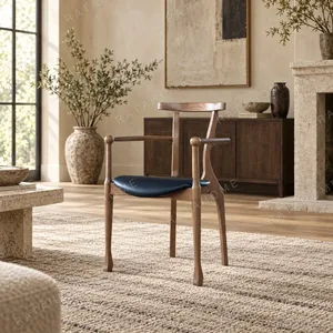 Ash Sculptural Armchair with Saddle Leather Seat, 55 cm in walnut — in a room setting