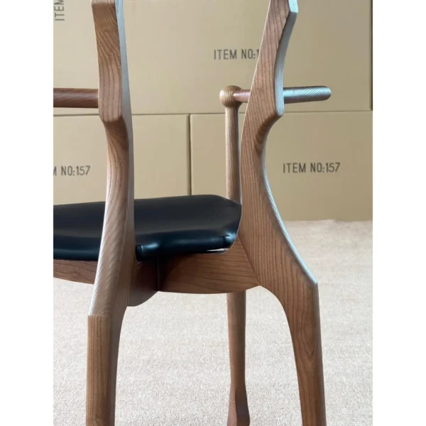 Ash Sculptural Armchair with Saddle Leather Seat, 55 cm in walnut — in a room setting