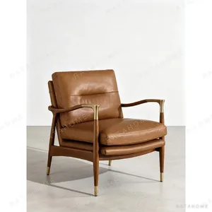 Walnut Lounge Chair in Vintage Tan Leather with Brass — in a room setting