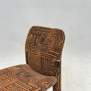 Geometric Pattern Upholstered Dining Chair with Brass Detail in rust — front view