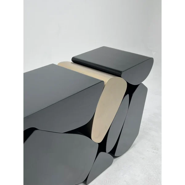 Stacked Pebble Sculptural Console in Black and Champagne — in a room setting