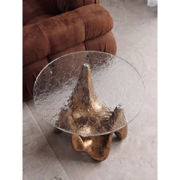 Ripple Glass Round Side Table on Gilded Sculptural Base in brushed brass — in a room setting