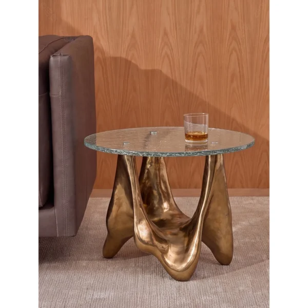 Ripple Glass Round Side Table on Gilded Sculptural Base in brushed brass — in a room setting