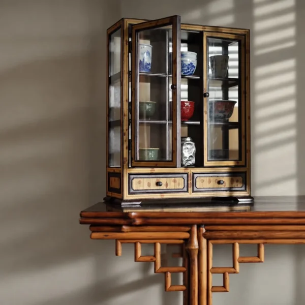 Bamboo-Framed Glass Double-Door Teacup Display Cabinet in clay — in a room setting
