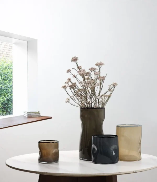 Hand-Blown Pleated Glass Vases in Pale Green and Smoke — in a room setting
