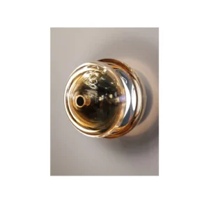 Gold Mirrored Glass Globe Wall Light in brushed brass — in a room setting