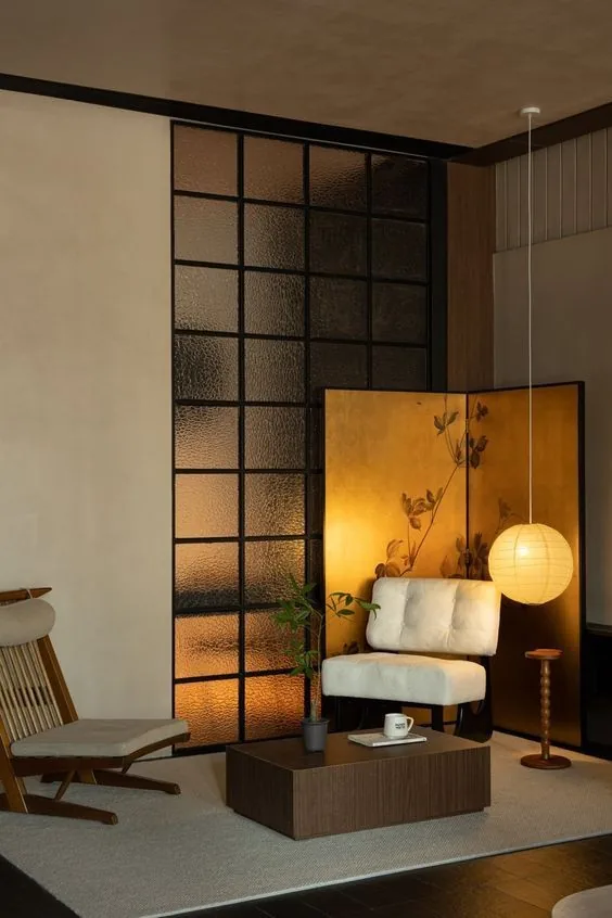 Hand-Beaten Gold Leaf Three-Panel Folding Screen in brushed brass — in a room setting