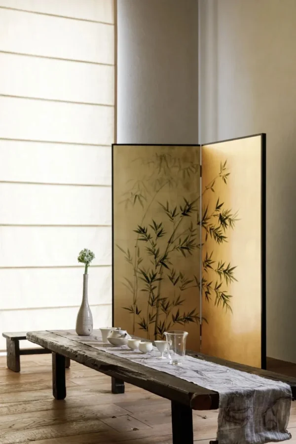 Hand-Beaten Gold Leaf Three-Panel Folding Screen in brushed brass — in a room setting