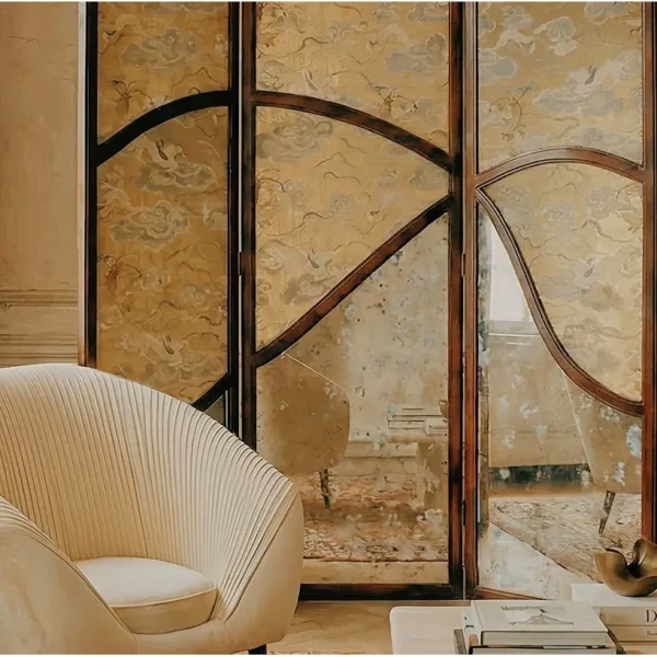 Gold Leaf and Walnut Cloud-Crane Folding Screen in brushed brass — in a room setting