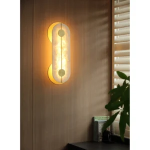 Gold Rim Alabaster-Look Column Wall Light in brushed brass — in a room setting