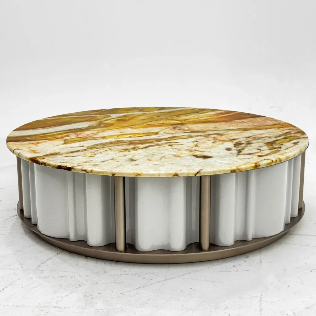 Round Gold Vein Stone Coffee Table on Fluted White Base in brushed brass — front view