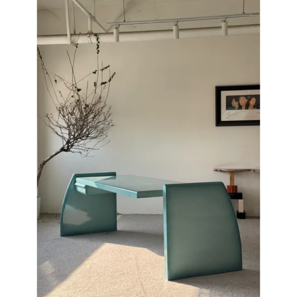 Gradient Blue Lacquered Desk with Hidden Drawer in blue — in a room setting