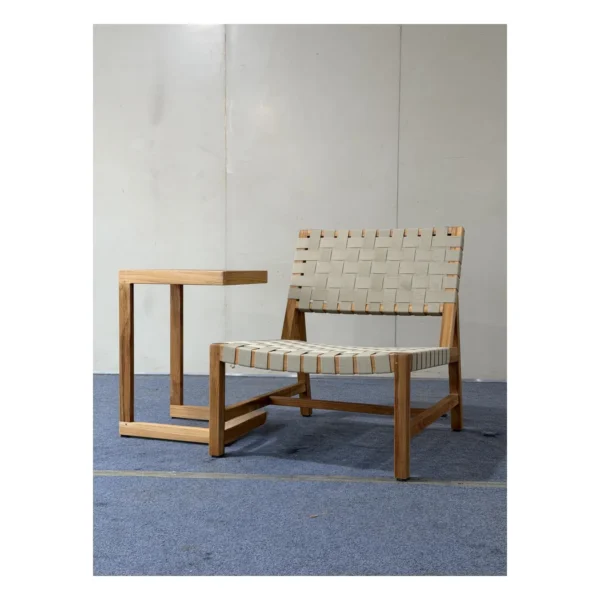 Teak Outdoor Lounge Chair with 45 mm Woven Webbing in natural oak — in a room setting
