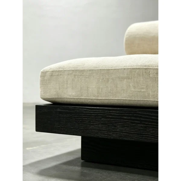 Black Oak Plinth Lounge Chair with Linen Cushion and Bolster in black — in a room setting