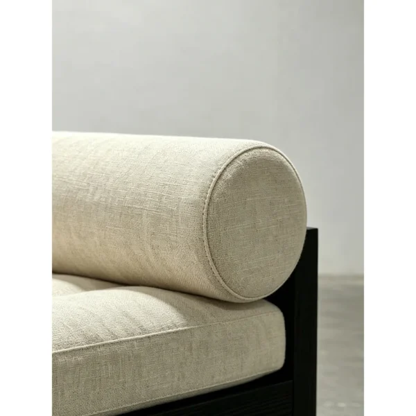 Black Oak Plinth Lounge Chair with Linen Cushion and Bolster in black — in a room setting
