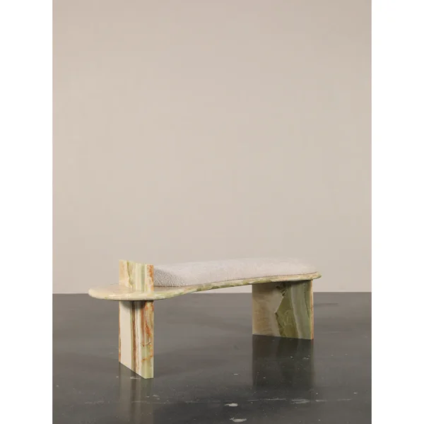 Green Onyx Curved Bench with Bouclé Cushion in olive — in a room setting
