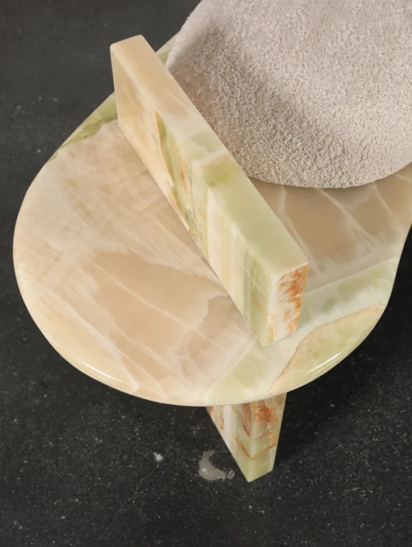 Green Onyx Curved Bench with Bouclé Cushion in olive — in a room setting