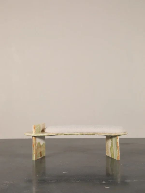 Green Onyx Curved Bench with Bouclé Cushion in olive — in a room setting