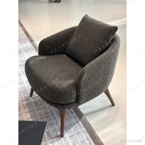 Green Dot Weave Lounge Chair in olive — in a room setting