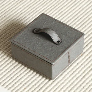 Grey Crinkled Leather Lidded Storage Box with Strap Pull in slate — front view