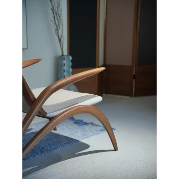 Growing Ash Lounge Chair in natural oak — in a room setting