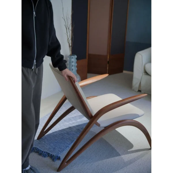 Growing Ash Lounge Chair in natural oak — in a room setting