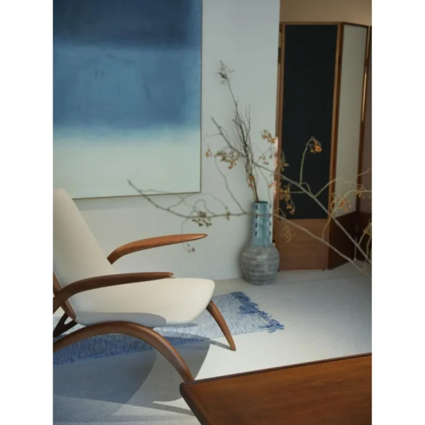Growing Ash Lounge Chair in natural oak — in a room setting