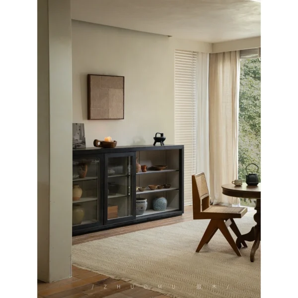 Blackened Teak Glass-Door Low Display Cabinet in black — in a room setting
