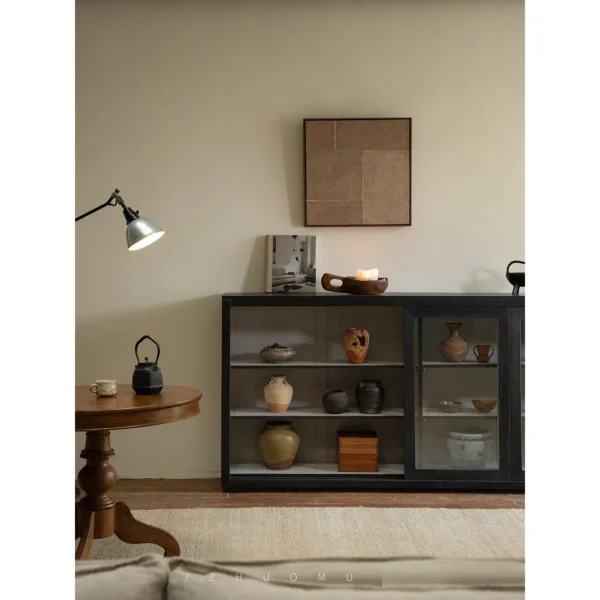 Blackened Teak Glass-Door Low Display Cabinet in black — in a room setting