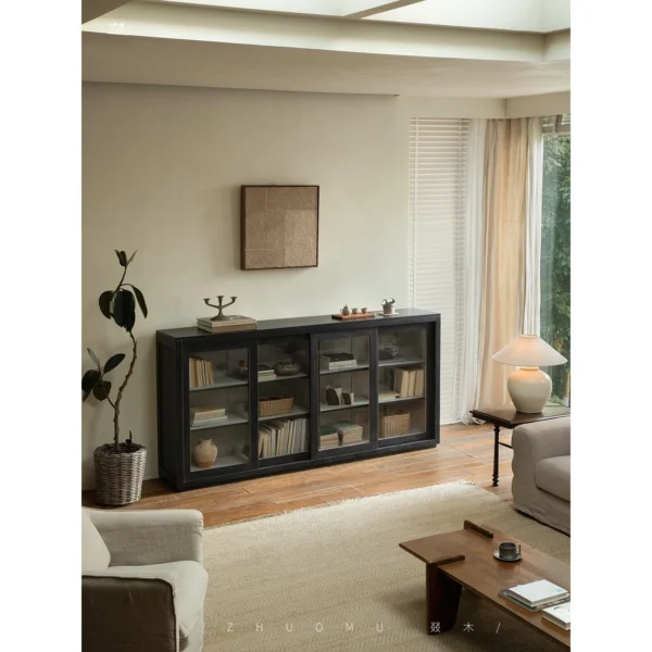 Blackened Teak Glass-Door Low Display Cabinet in black — in a room setting