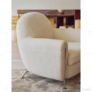 Hamburger Lounge Chair in White Shearling on Steel Legs — in a room setting