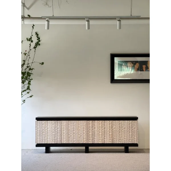 Hammer-Carved Ash Low Sideboard in Black and Natural — in a room setting