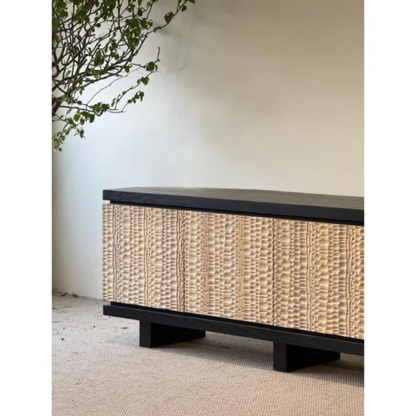 Hammer-Carved Ash Low Sideboard in Black and Natural — in a room setting