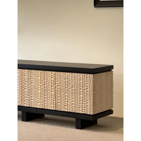 Hammer-Carved Ash Low Sideboard in Black and Natural — in a room setting