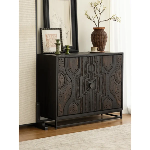 Hand-Carved Totem Door Teak Cabinet on Black Metal Base in black — in a room setting