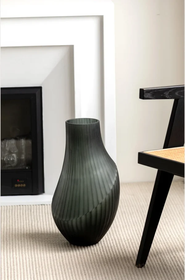 Hand-Carved Irregular Dark Green Glass Vase in olive — in a room setting