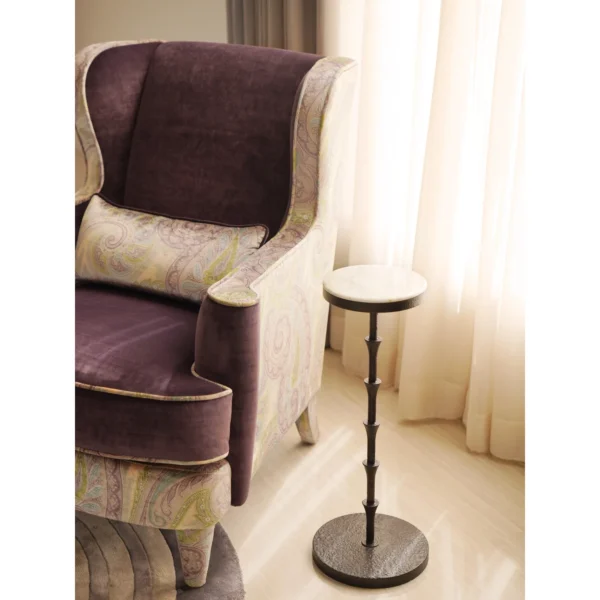 Hand-Forged Bamboo-Node Iron Side Table in black — in a room setting