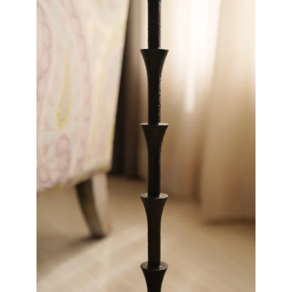 Hand-Forged Bamboo-Node Iron Side Table in black — in a room setting