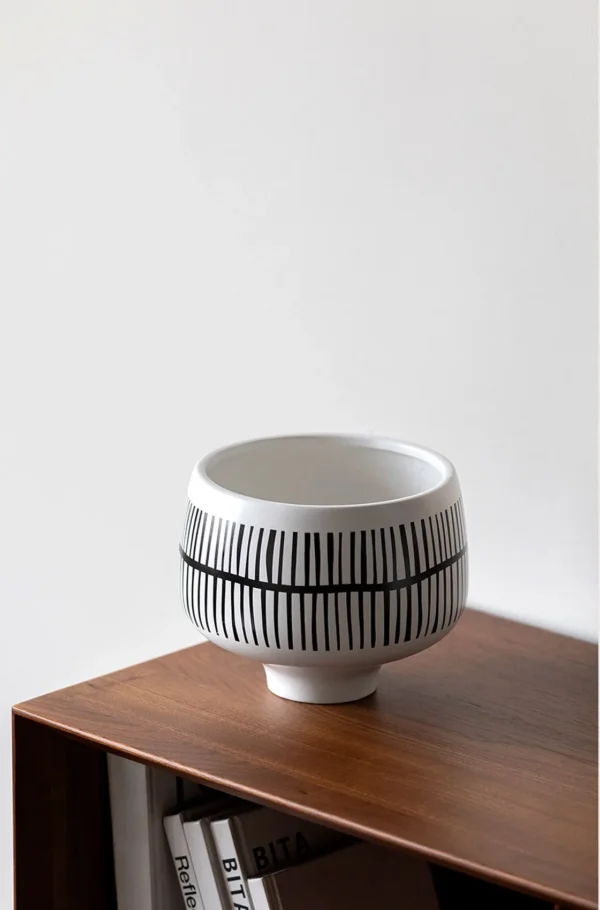 Hand-Painted Black Line Footed Bowl Vase in White — in a room setting