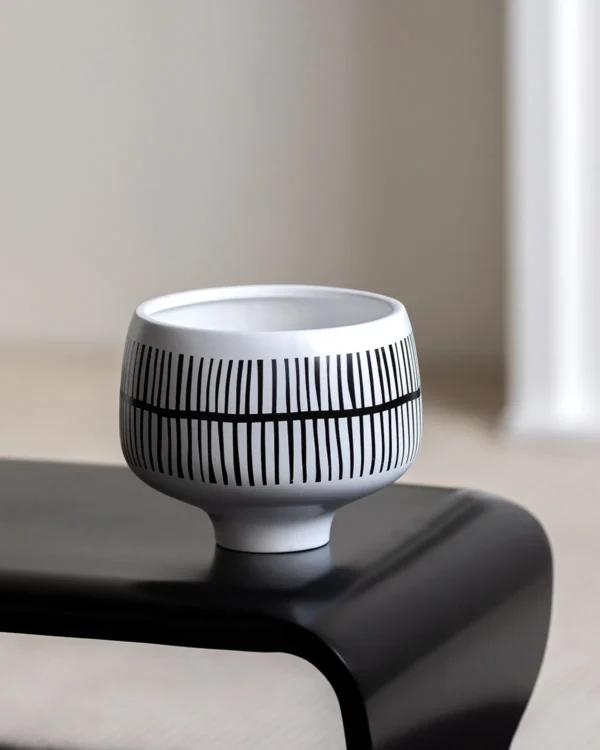 Hand-Painted Black Line Footed Bowl Vase in White — in a room setting