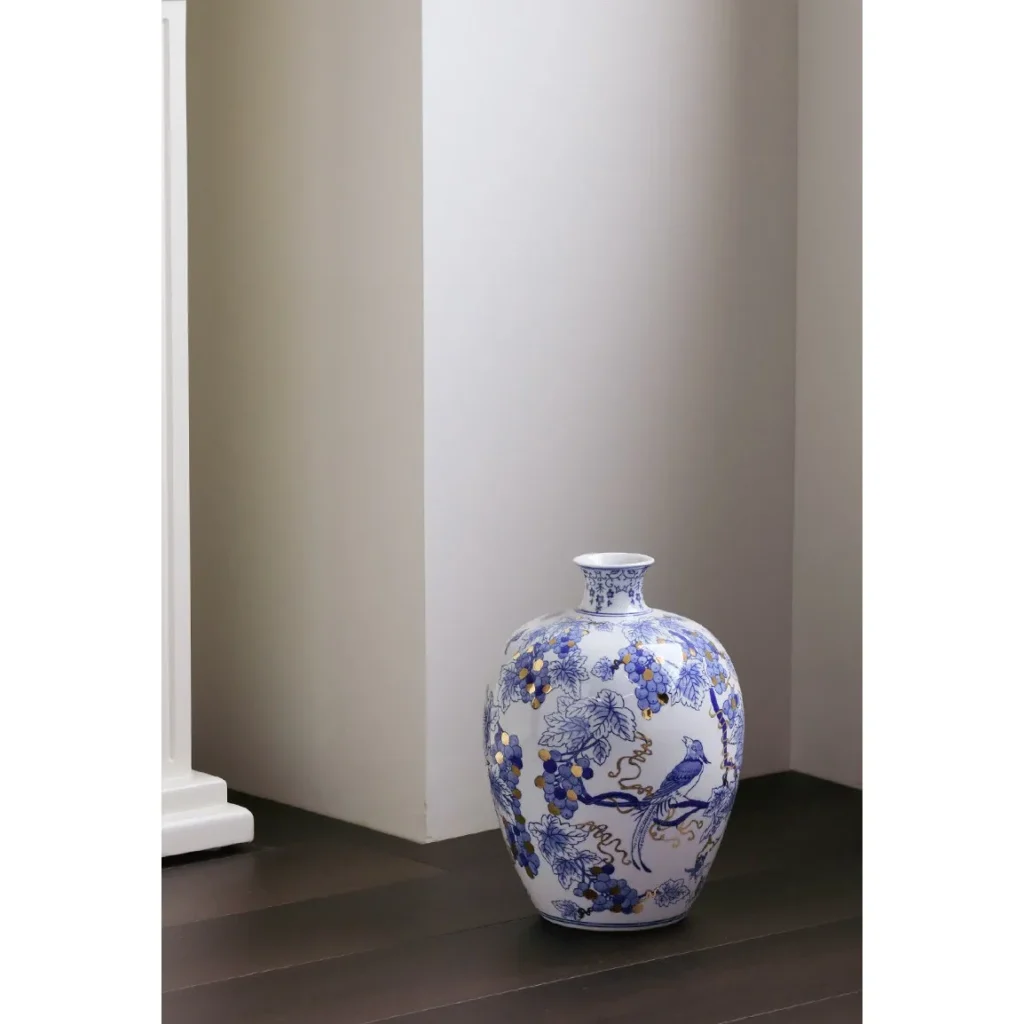 Hand-Painted Blue and White Gilded Fruit-Branch Vase in ivory — in a room setting