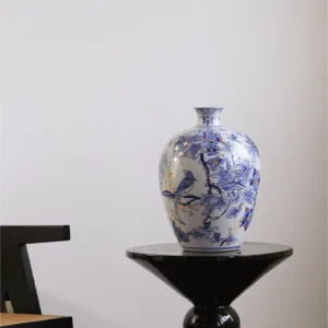 Hand-Painted Blue and White Gilded Fruit-Branch Vase in ivory — in a room setting