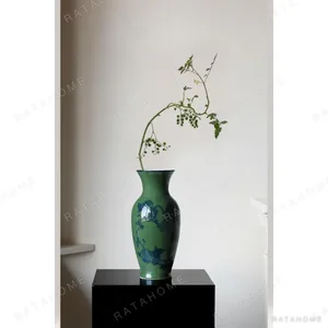 Hand-Painted Green Ground Porcelain Vase with Blue Hydrangea in olive — in a room setting